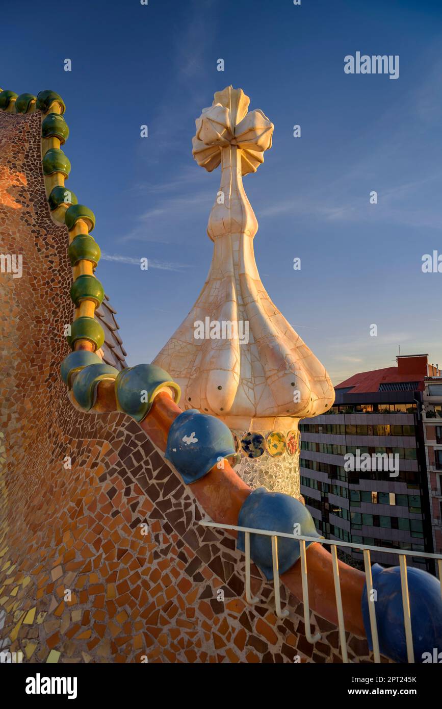 Roof of Casa Batlló with the shape of dragon scales and the cross of ...