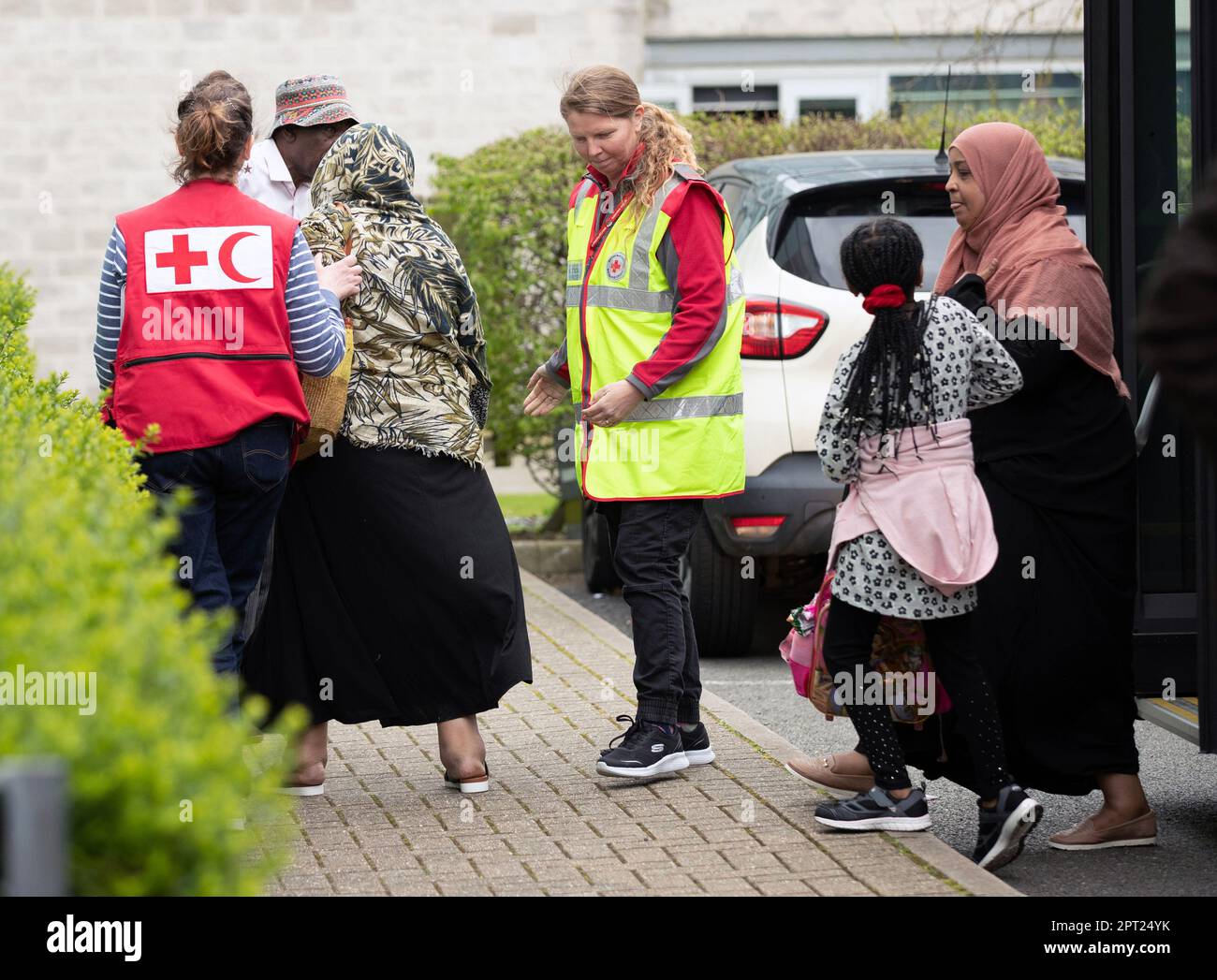 British nationals arrive at the Radisson Blue hotel at Stansted Airport in Essex, after being airlifted from Sudan. The British evacuation mission from the African country has seen 536 people taken to safety on six flights so far, according to the latest official figures. Picture date: Thursday April 27, 2023. Stock Photo