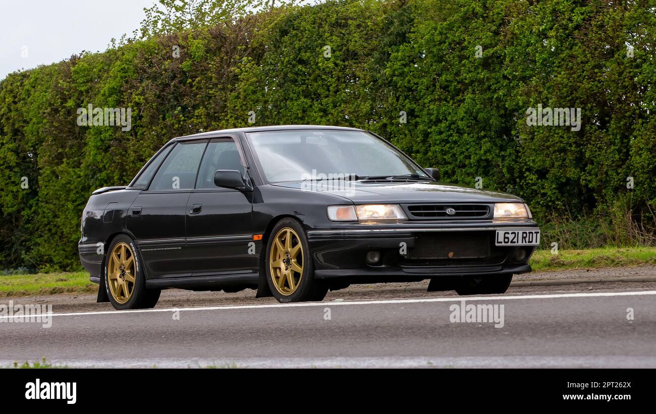 Bicester,Oxon,UK - April 23rd 2023. 1994 SUBARU LEGACY TURBO 4WD car travelling on an English country road Stock Photo