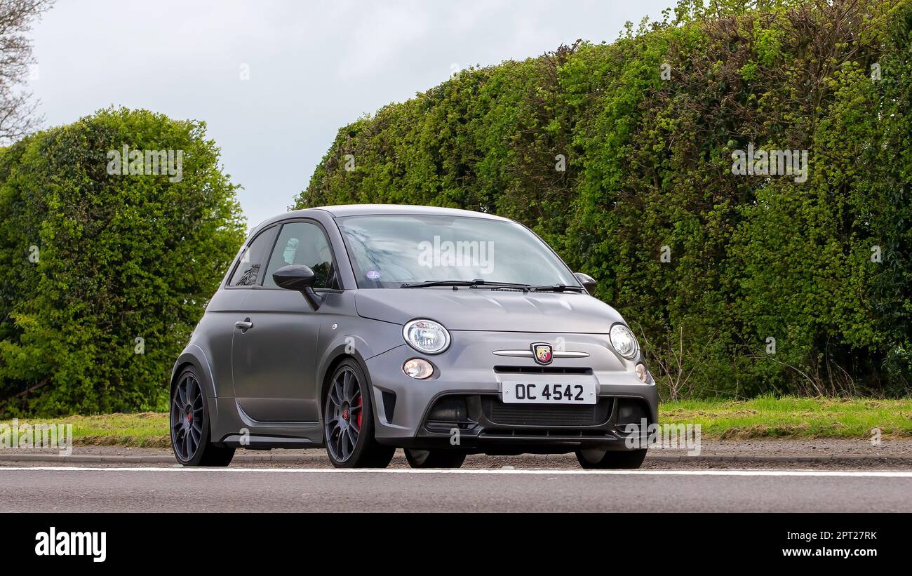 Bicester,Oxon,UK - April 23rd 2023. 2016 Fiat 500 ABARTH 695 car travelling on an English country road Stock Photo
