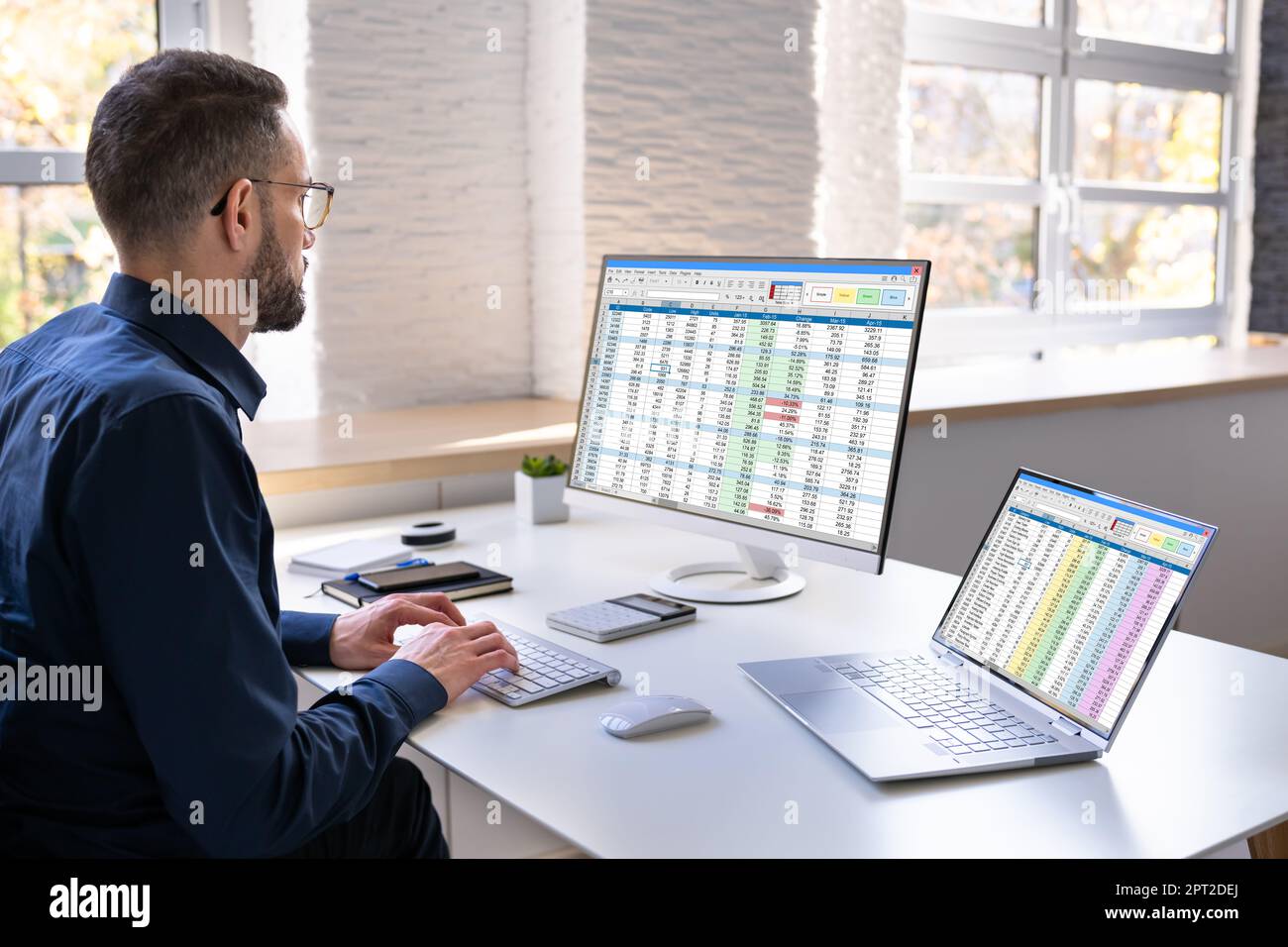 Auditor Employee And Data Analyst Using Computer Spreadsheet Stock Photo