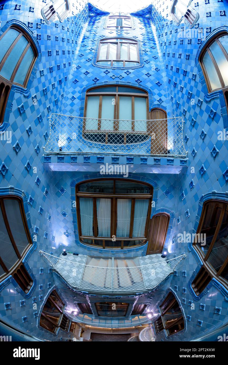 Inner courtyard of Casa Batlló decorated with a gradient mosaic from blue to white designed by Gaudí (Barcelona, Catalonia, Spain) Stock Photo