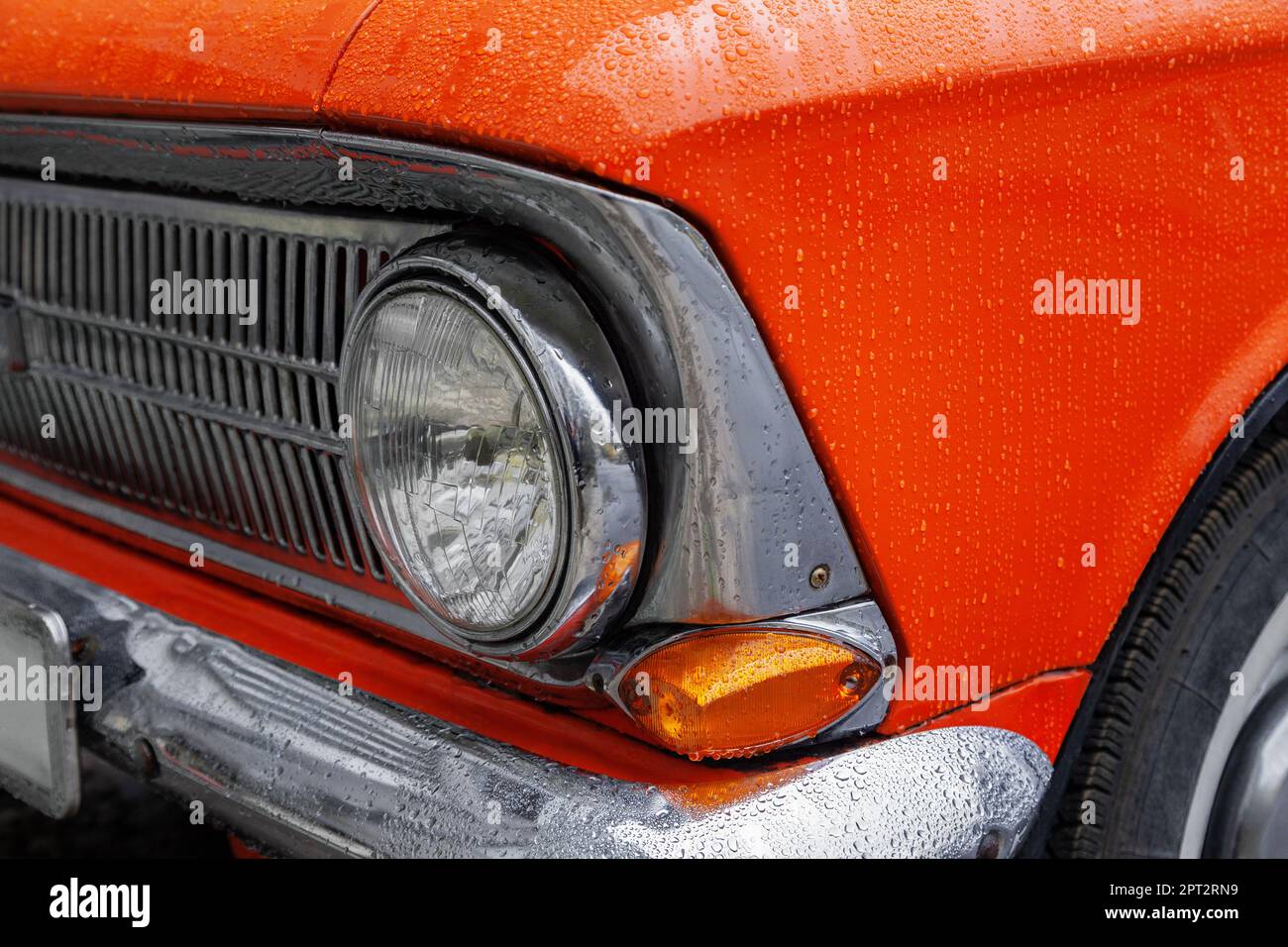 Front of orange retro car, close-up Stock Photo