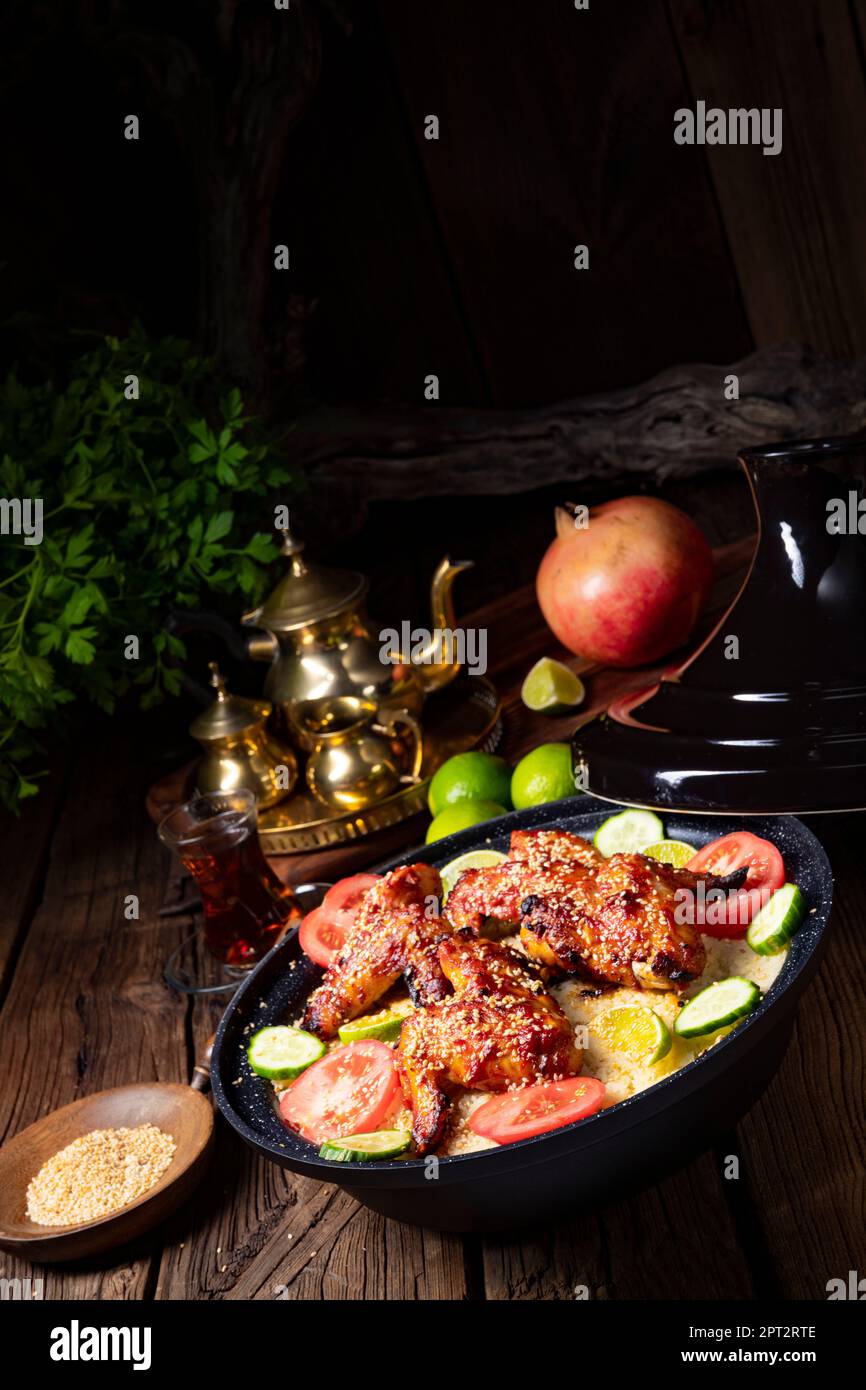 couscous with fried chicken wings spicy Stock Photo Alamy