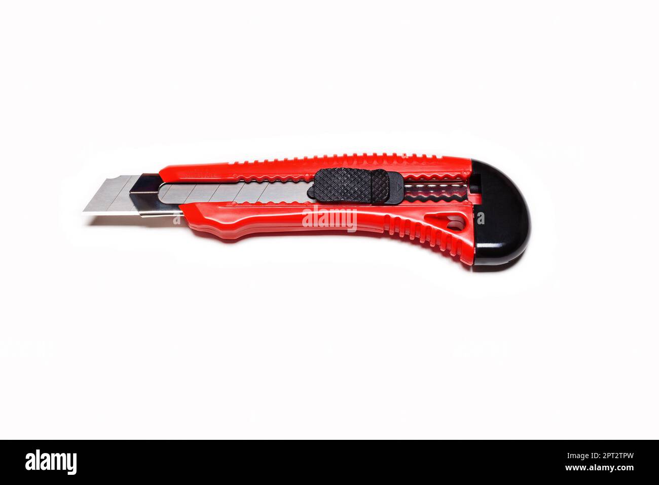 Red clerical knife on a white background Stock Photo