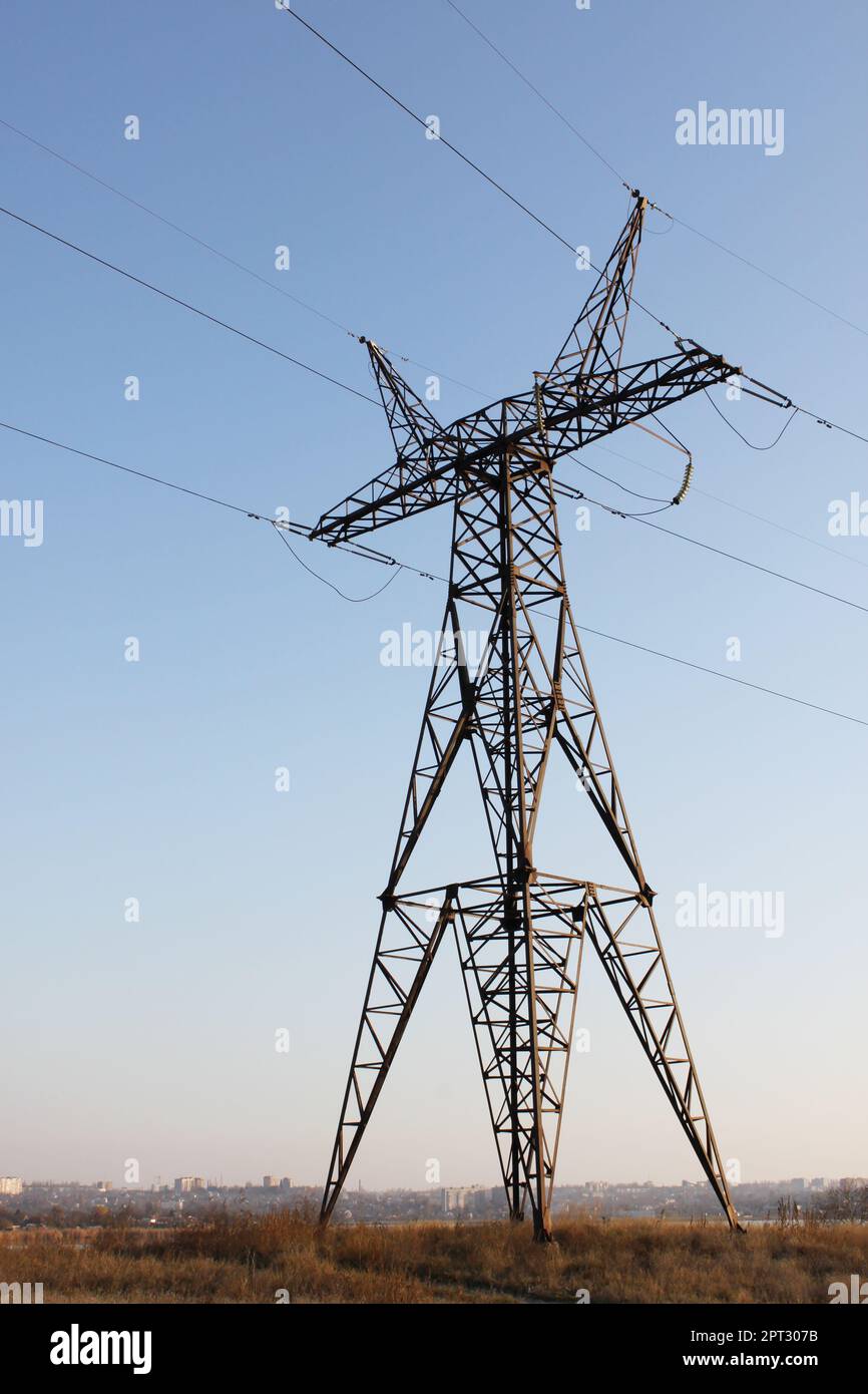 view on electricity pylon standing in country in Ukraine Stock Photo