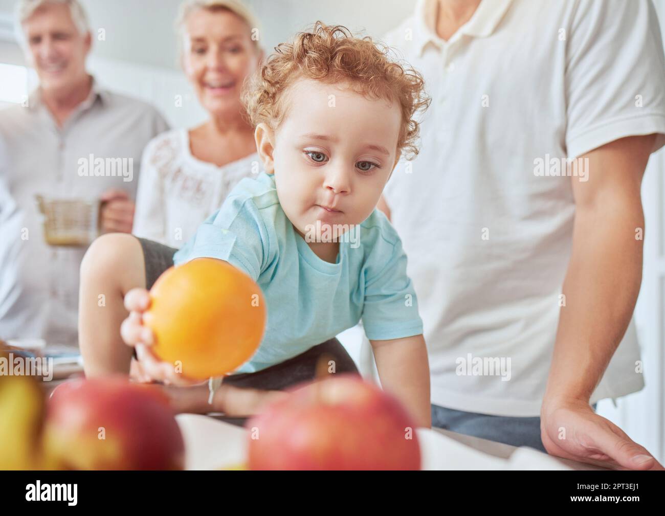 Health, family and baby with orange nutrition for healthy diet