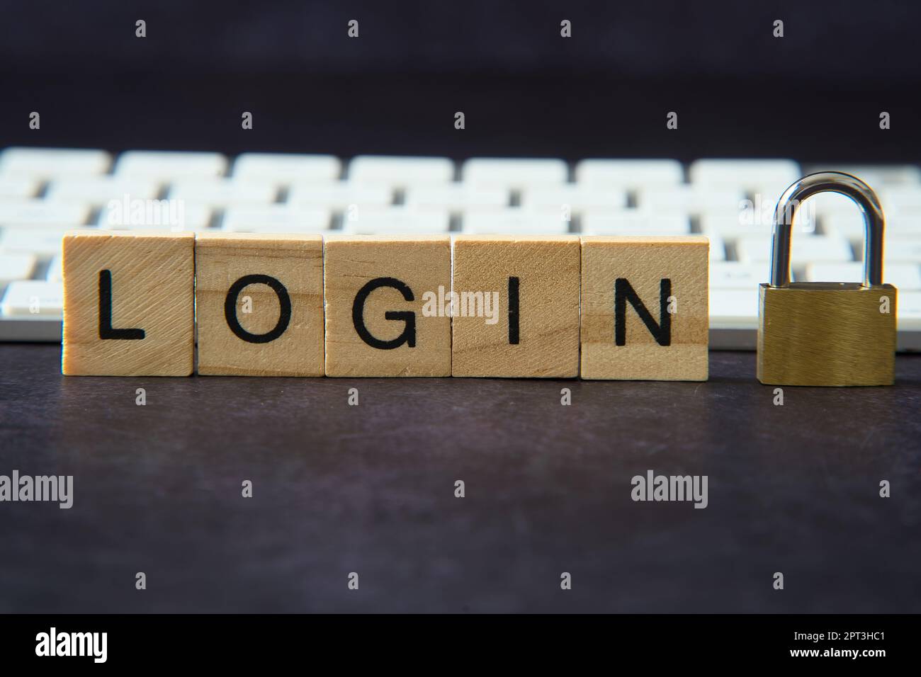 Word "login" written in wooden letters next to a padlock representing