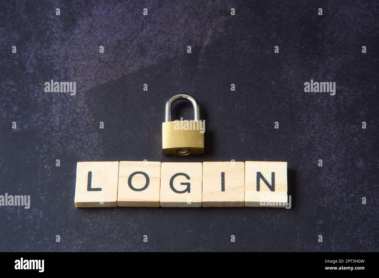 Word "login" written in wooden letters next to a padlock representing