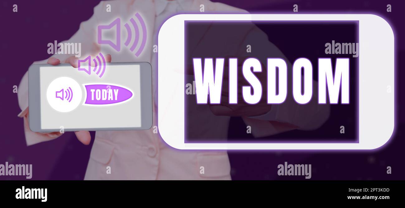 Text sign showing Wisdom, Word for body of knowledge and principles that develops within specific period Woman Holding A Pad With Laptop And Other Sig Stock Photo