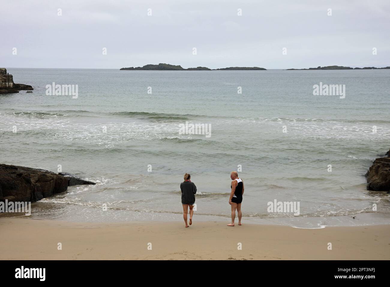 Cold water swimmers at Portrush in winter Stock Photo