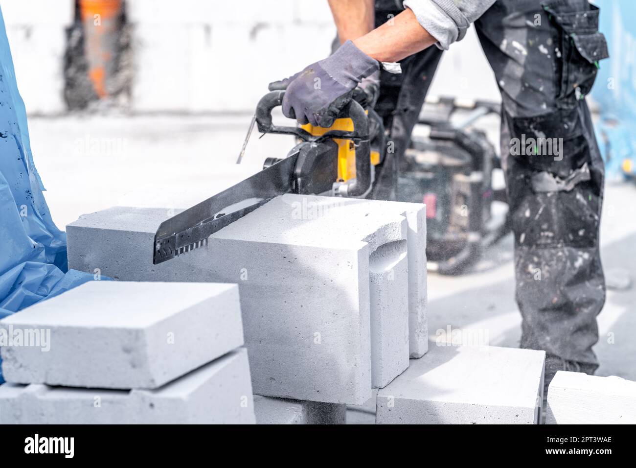 cutting concrete blocks with a saw during the construction of a building wall Stock Photo Alamy