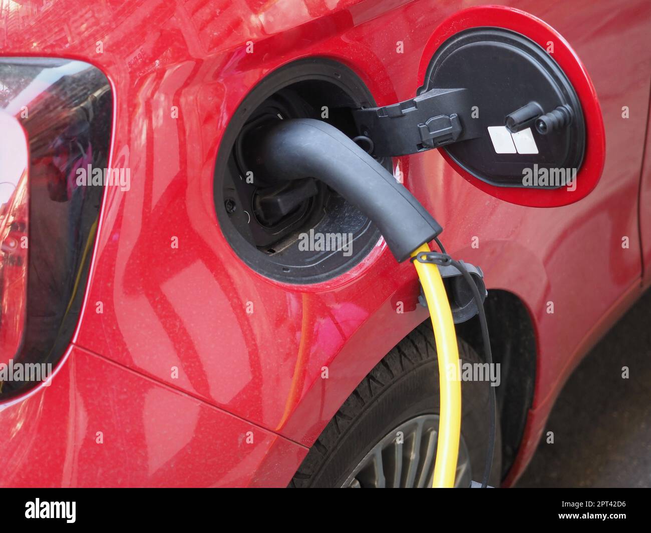 Car charging at electric car charging station Stock Photo
