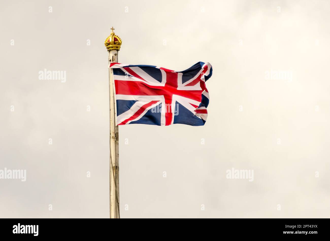Union Jack Flag flying on a cloudy day in London, UK Stock Photo