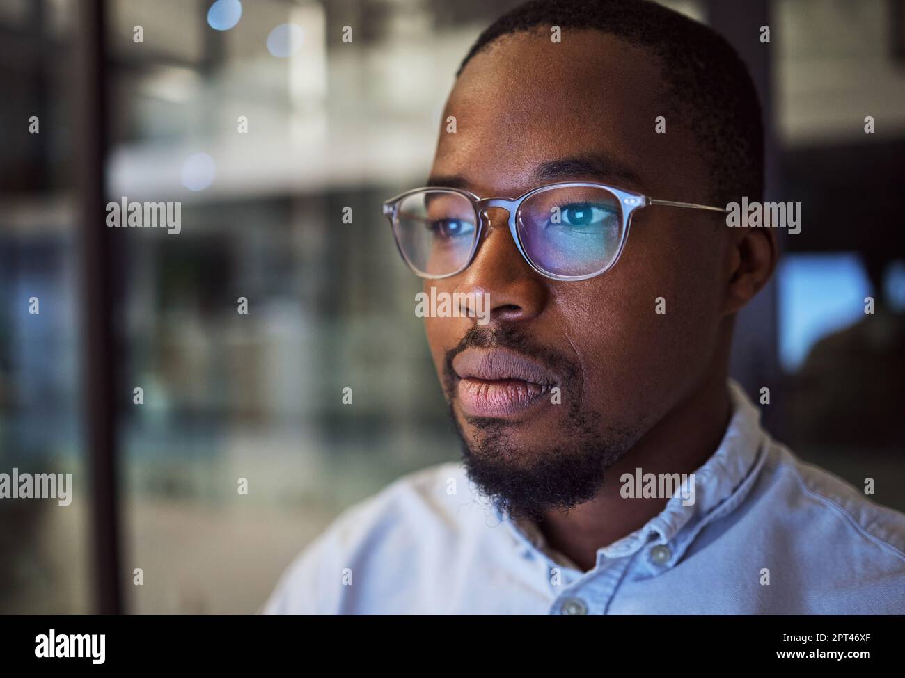 Information technology businessman with glasses and computer reflection