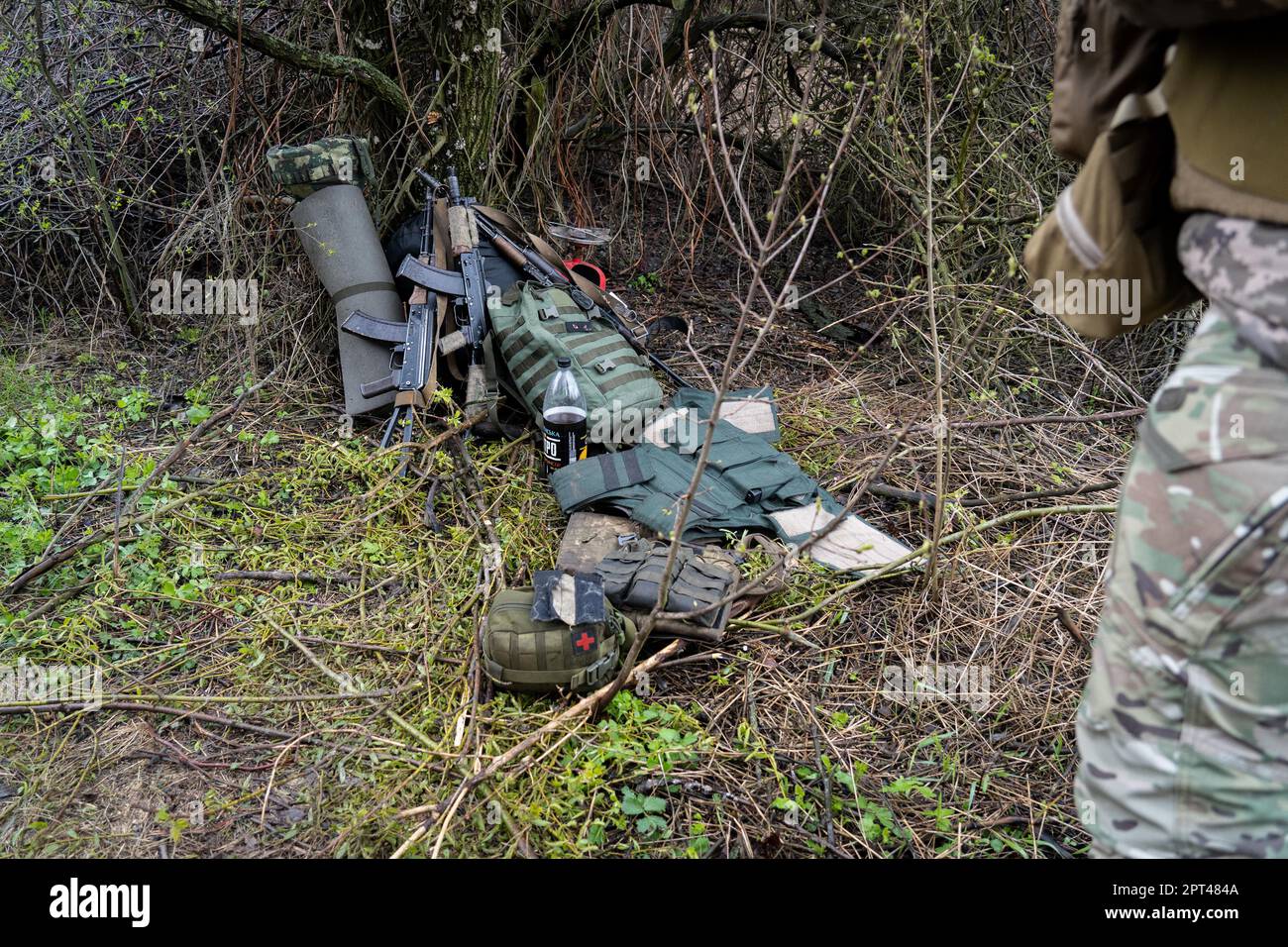 Bakhmut, Ukraine. 15th Apr, 2023. Guns, medical kit and some body armor are seen on the ground in the Ukrainian position near Bakhmut. Ukrainian armed force is fighting intensely in Bakhmut and the surrounding area as Russian forces are getting ever closer to taking the eastern city of Ukraine. The battle of Bakhmut is now known as 'the bloodiest'' and 'one of the longest fight'', it has become one of the most significant fights in the war between Ukraine and Russia. (Credit Image: © Ashley Chan/SOPA Images via ZUMA Press Wire) EDITORIAL USAGE ONLY! Not for Commercial USAGE! Stock Photo