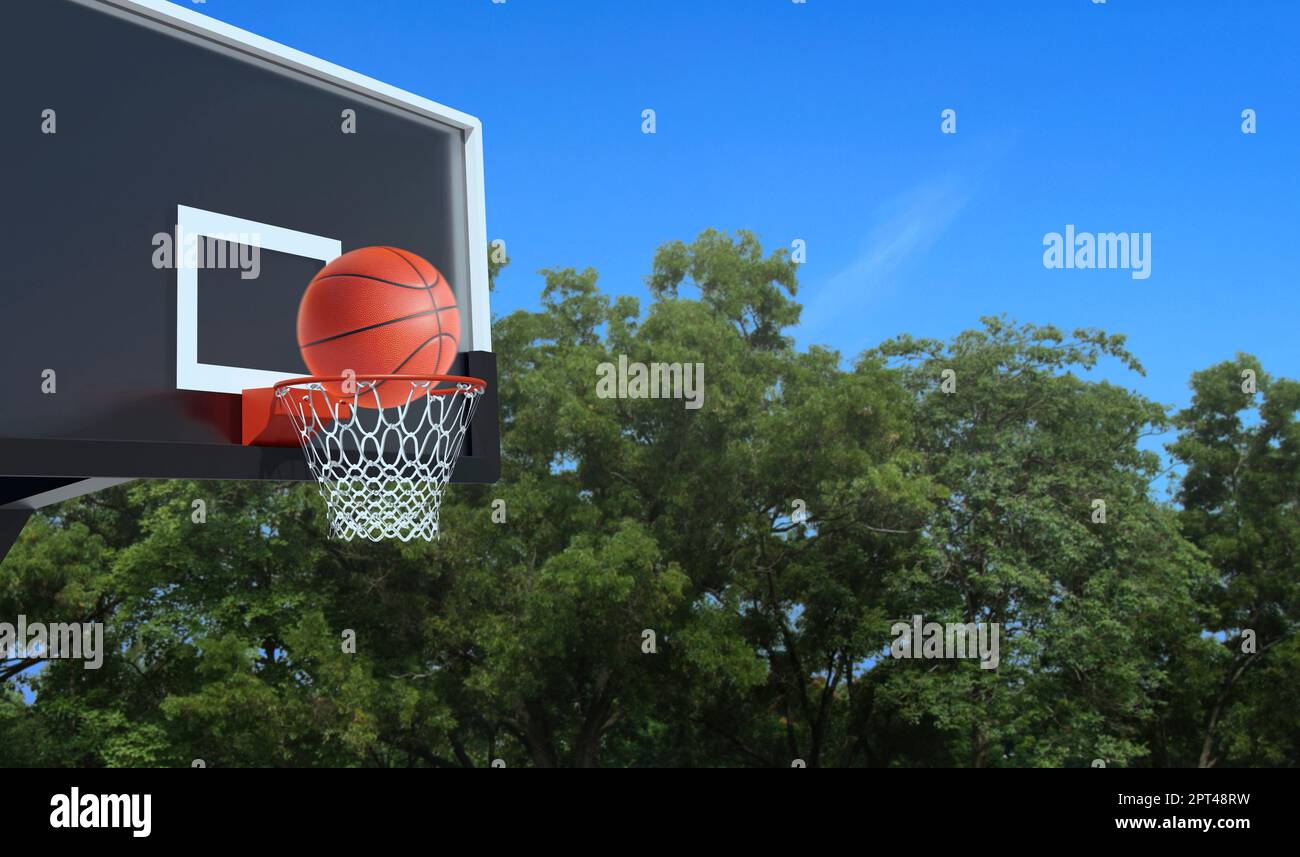 Ball for basketball and basketball hoop on white background. Hitting the ball in the basket