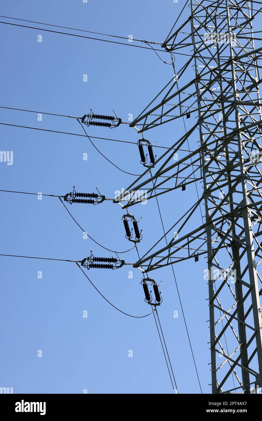 high voltage power pole and lines against the blue sky Stock Photo - Alamy