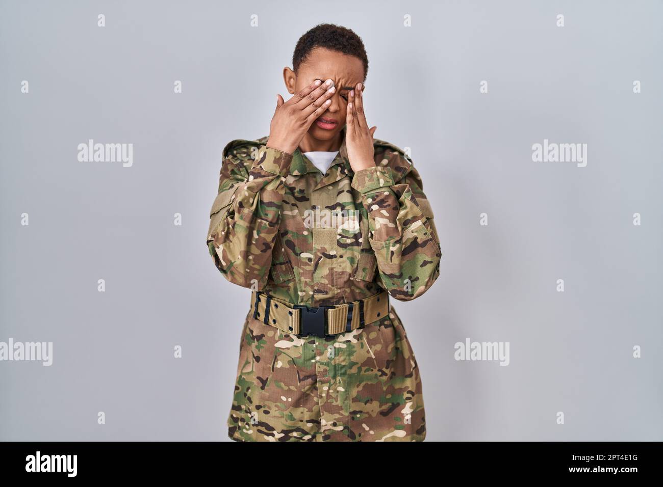 Beautiful african american woman wearing camouflage army uniform rubbing  eyes for fatigue and headache, sleepy and tired expression. vision problem  Stock Photo - Alamy