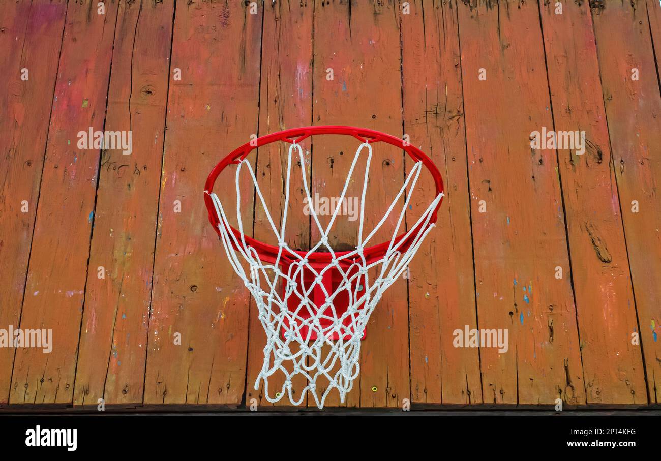 Basketball hoop with a net on a wooden backboard. Basketball game. Throw the ball. Team play. Street sports. Rest and leisure. Sports ground. Healthy Stock Photo