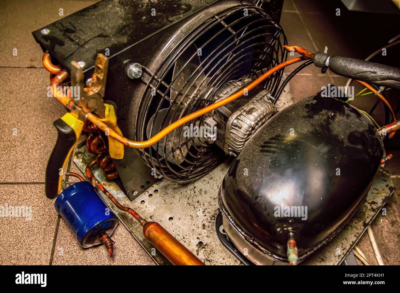 Repair of the engine of an industrial refrigerator unit. Refrigerator repair.  Industrial refrigeration equipment electric motor. Service of commercial  Stock Photo - Alamy