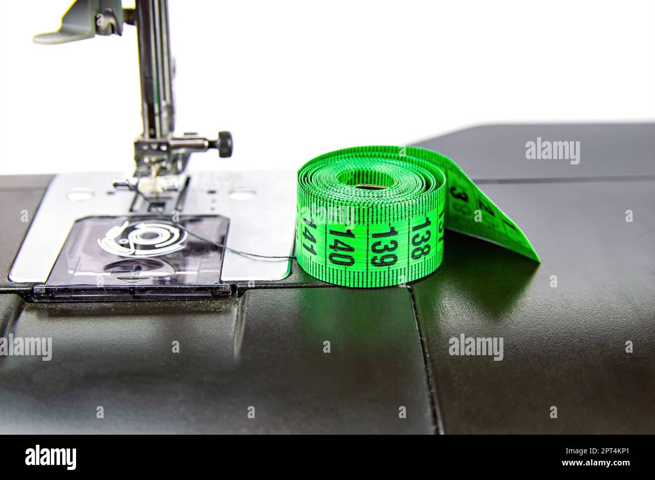 https://c8.alamy.com/comp/2PT4KP1/tailors-measuring-meter-on-a-sewing-machine-measuring-tool-seamstress-meter-sewing-machine-clothing-size-seamstress-equipment-working-profession-2PT4KP1.jpg