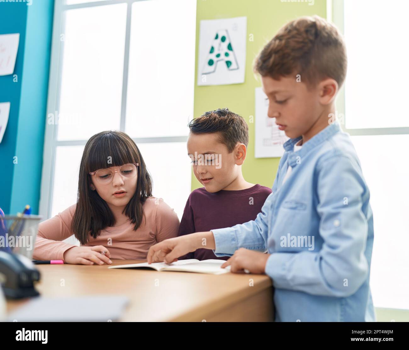 Children writing classroom enjoy hi-res stock photography and images ...