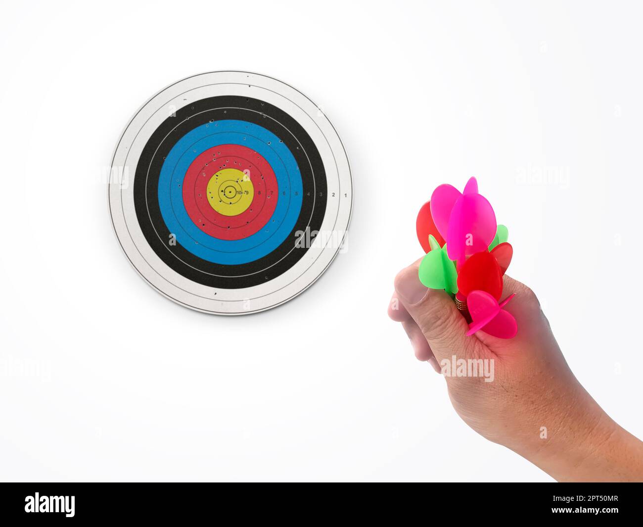 Human hand is throwing the darts target to the darts board. a man's