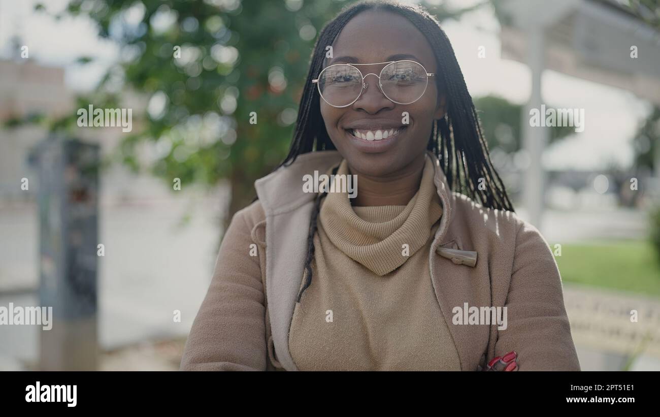 Laughing african woman wearing green hi-res stock photography and ...