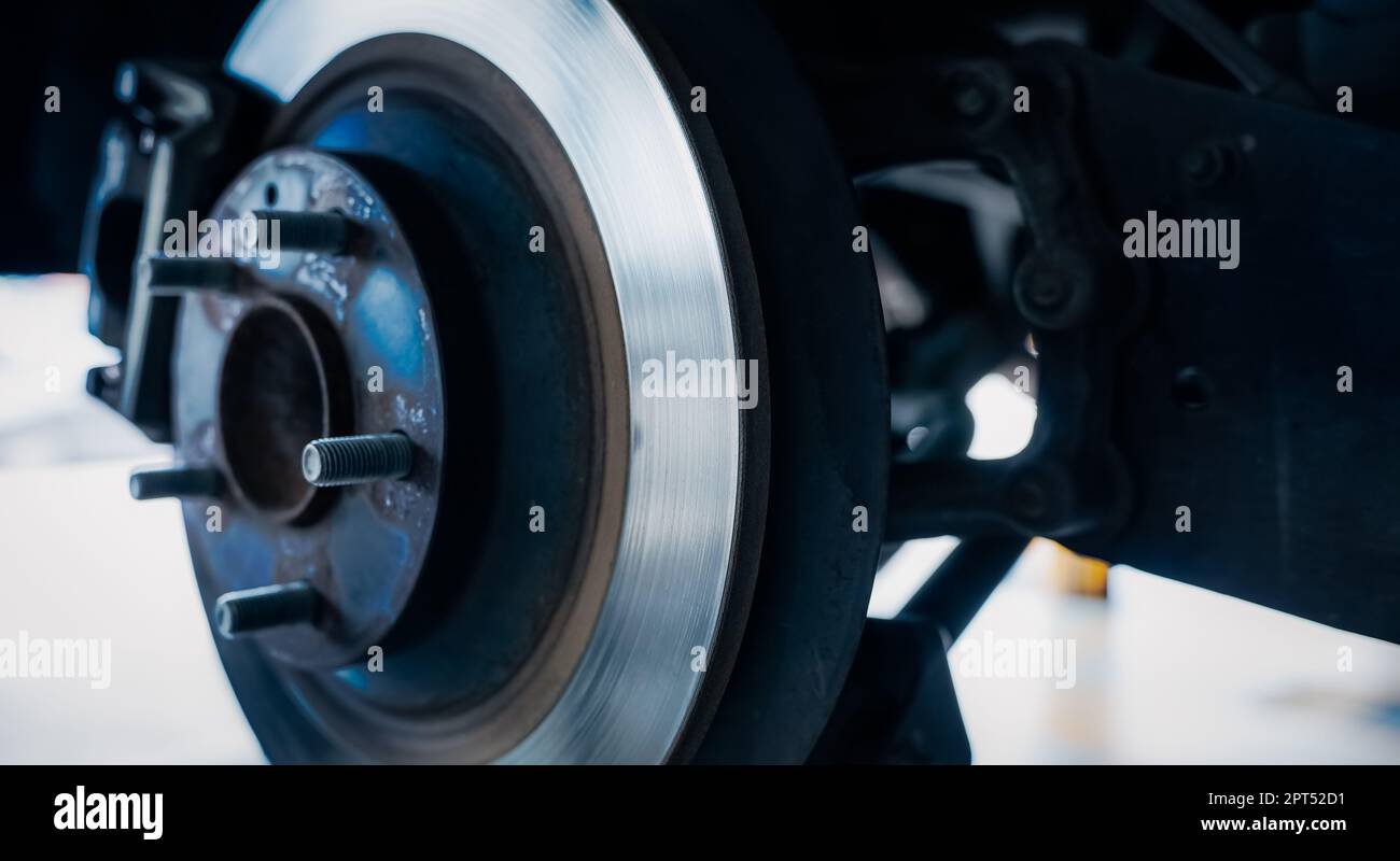 Car disc brake system. Car suspension in process of new tire