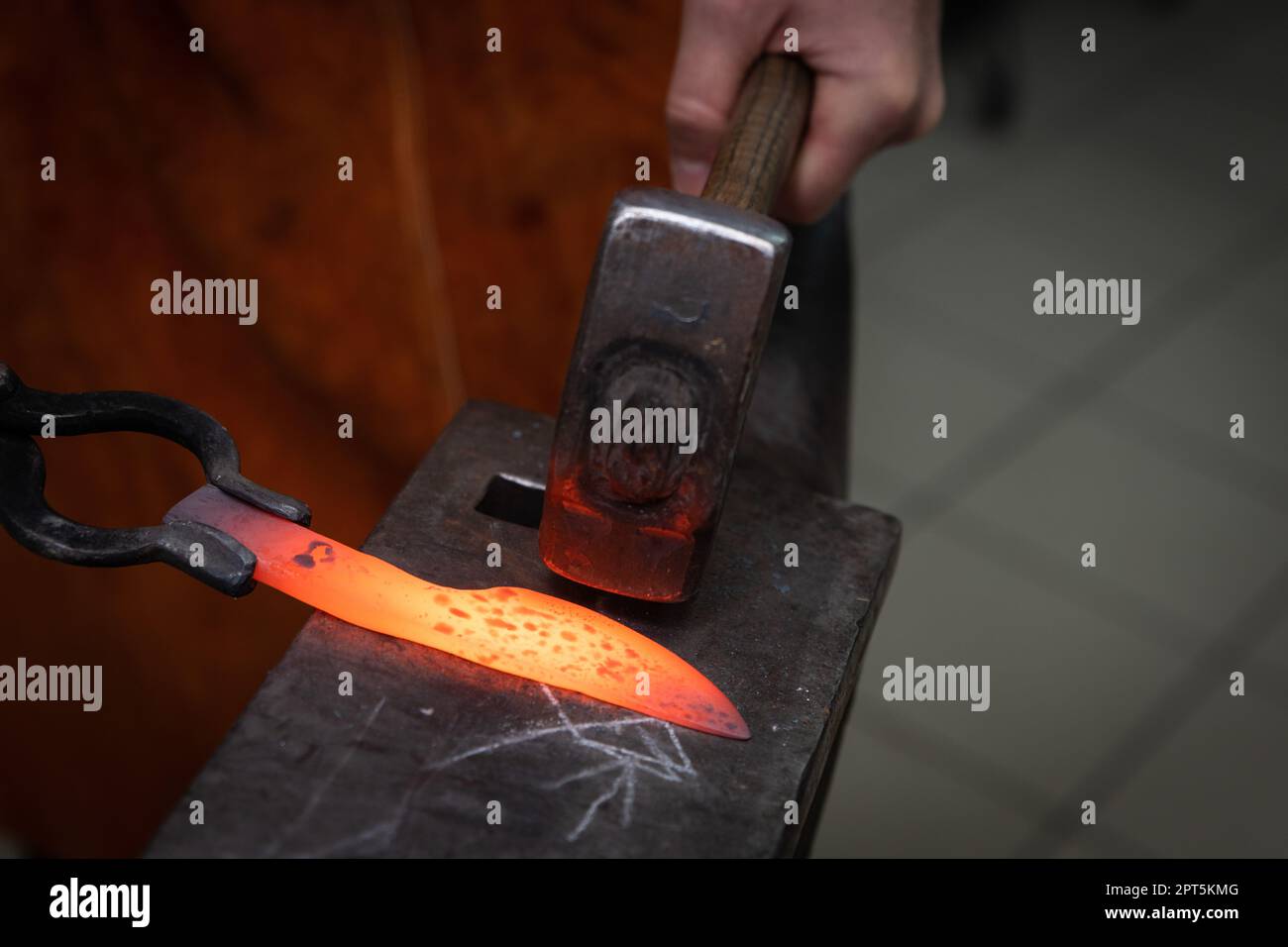 man hands are manufacturing a steel knife Stock Photo Alamy