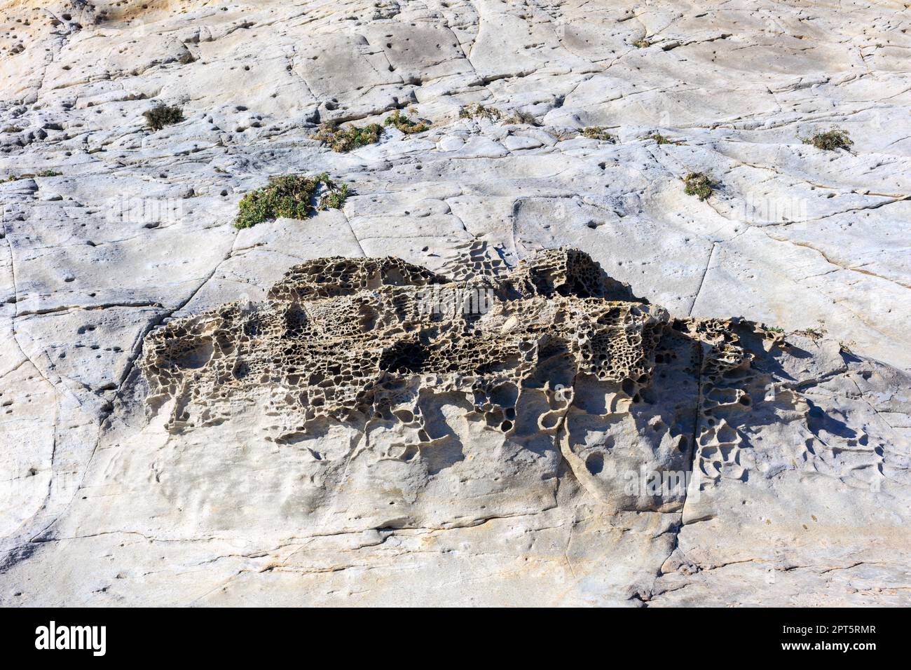 unusual rock formations of the volcanic cliff on Cala Sapone beach ...