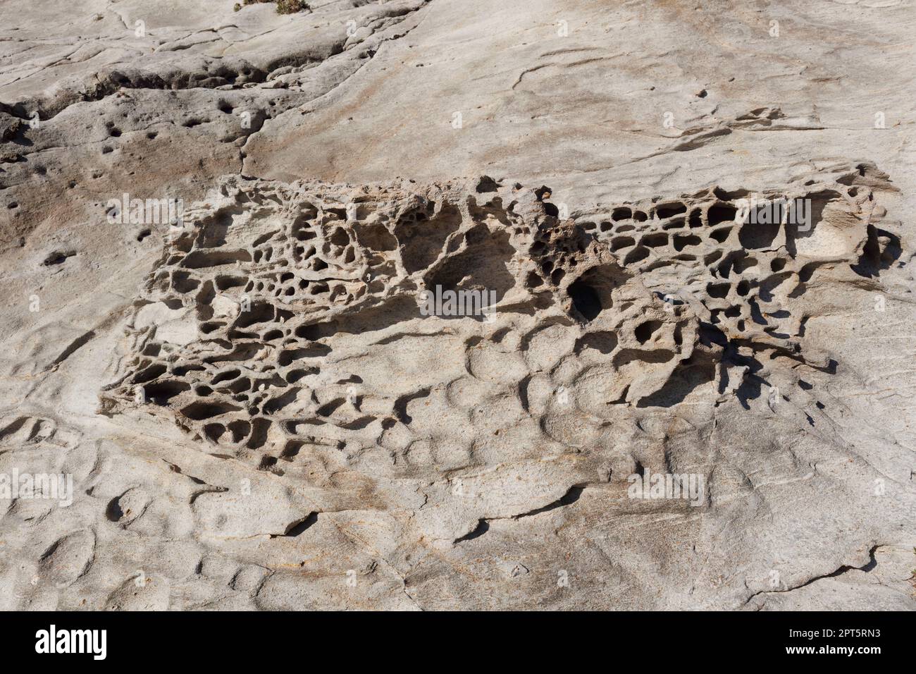unusual rock formations of the volcanic cliff on Cala Sapone beach ...