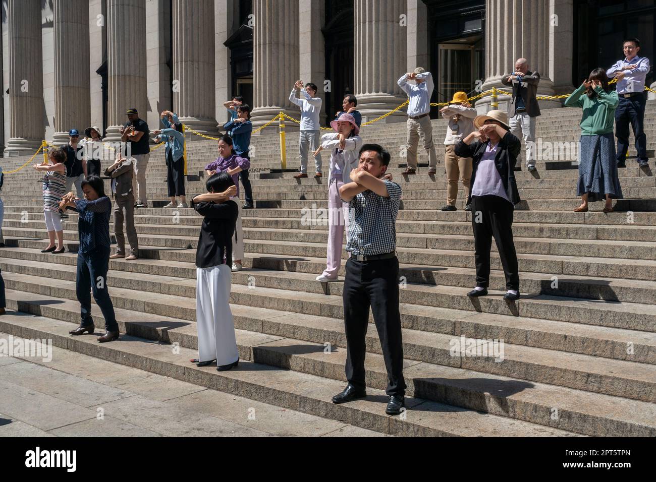 Members of Falun Dafa (Falun Gong)  practice Tai Chi in front of the James Farley Post Office in New York on Thursday, April 13, 2023.  Practitioners of Falun Dafa claim that they are being persecuted by the government in China for their spiritual beliefs. (© Richard B. Levine) Stock Photo