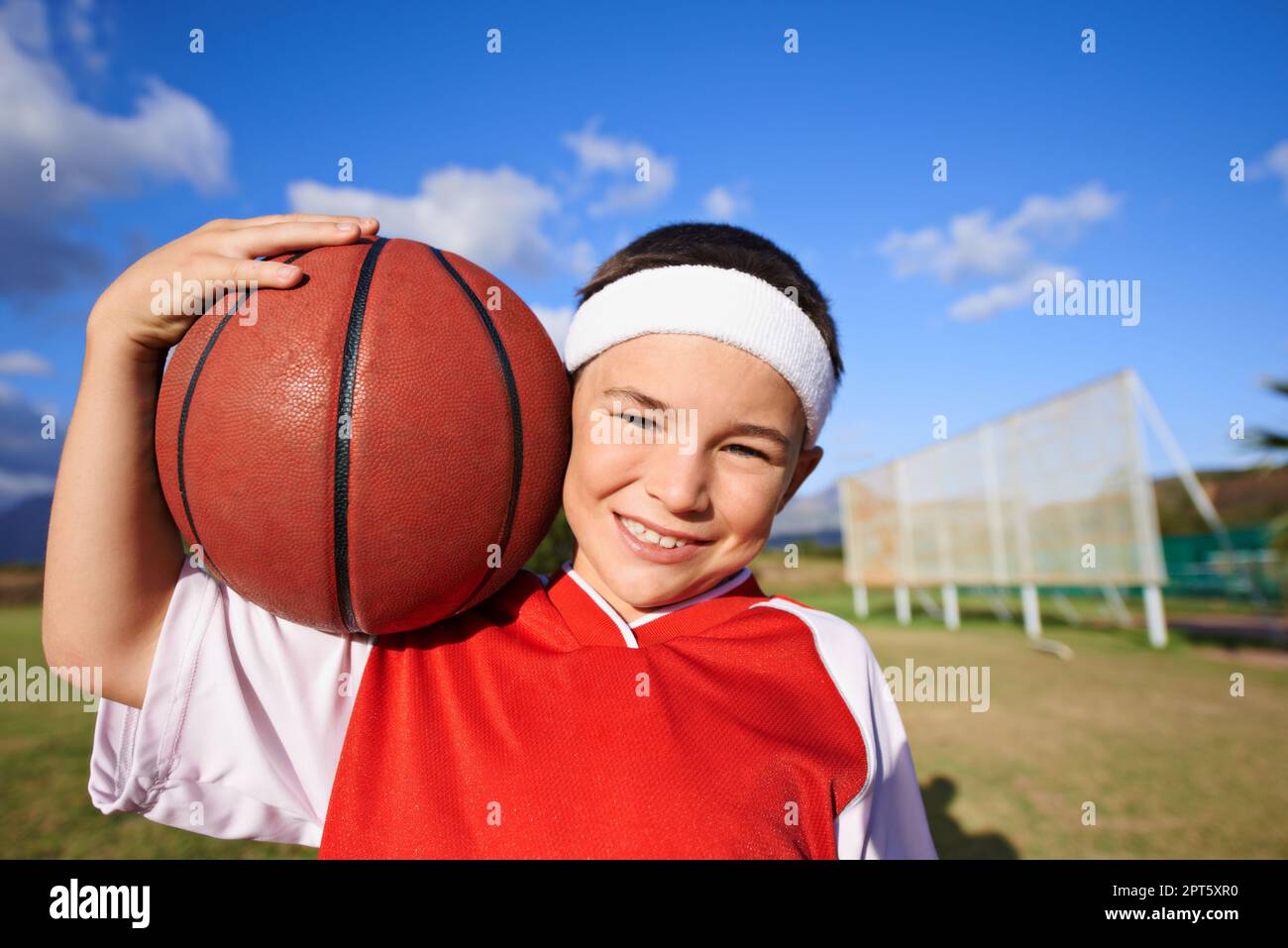 Little girl holding basketball hi-res stock photography and images