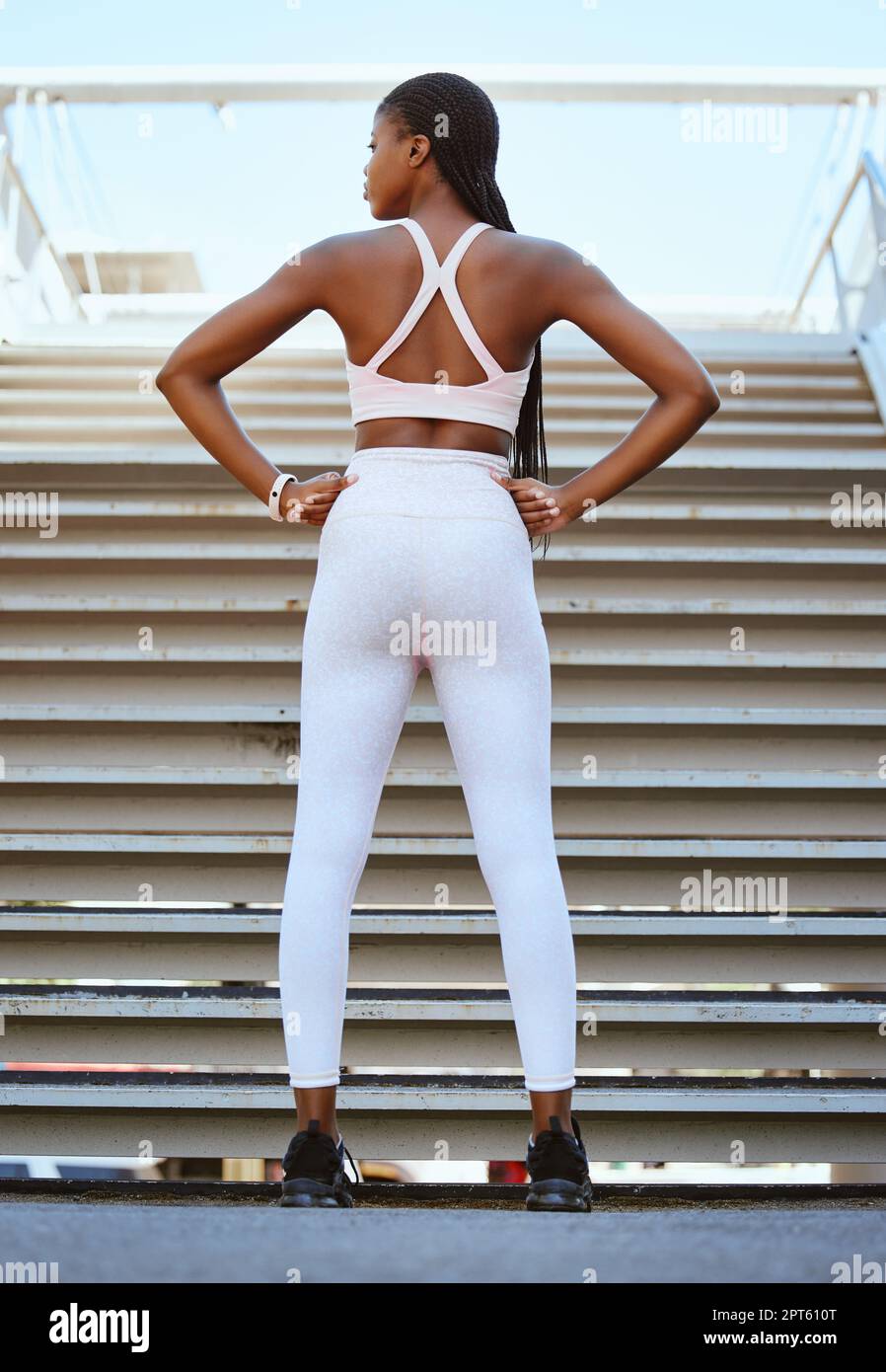 Black woman running up stairs hi-res stock photography and images - Alamy