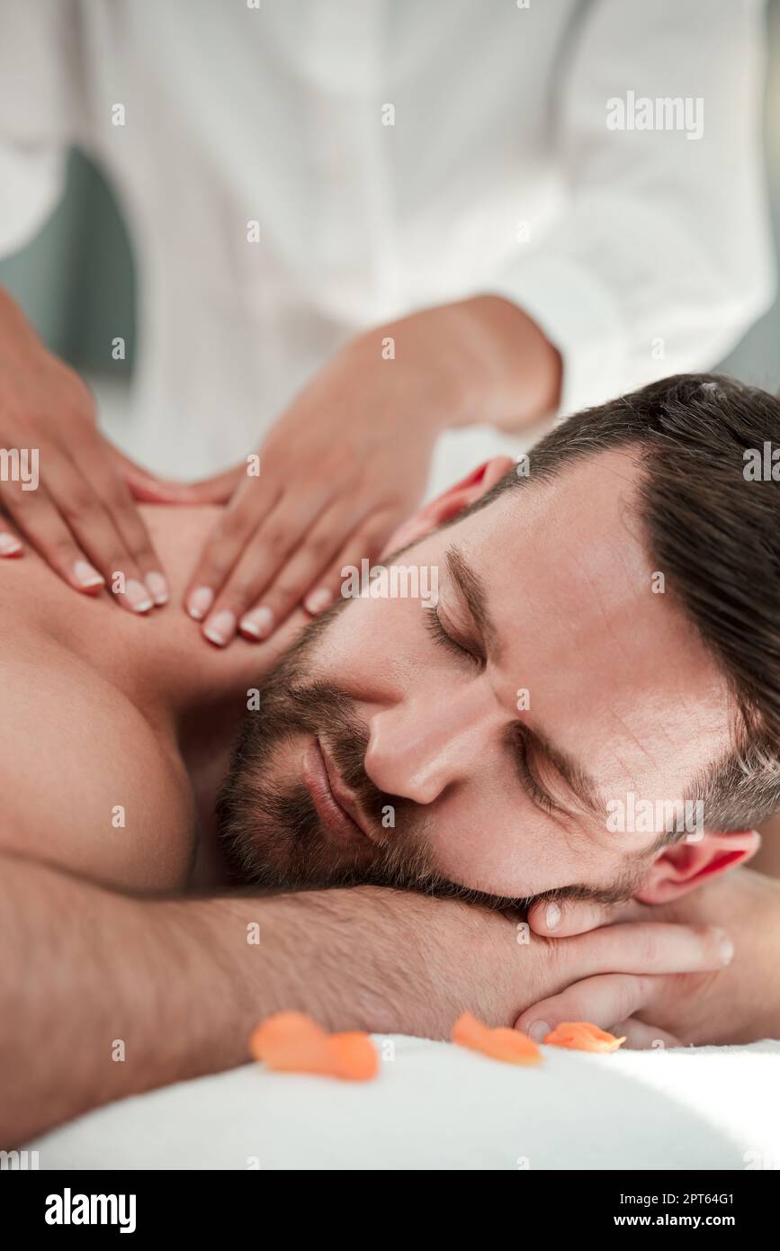 A woman giving a man shoulder massage Stock Photo - Alamy