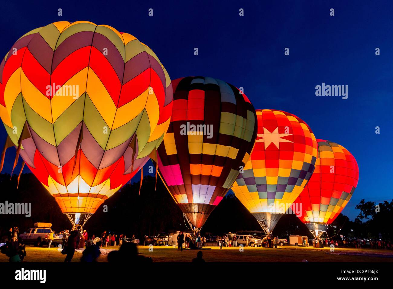 Four Hot Air Balloons are Launching at Dawn Stock Photo