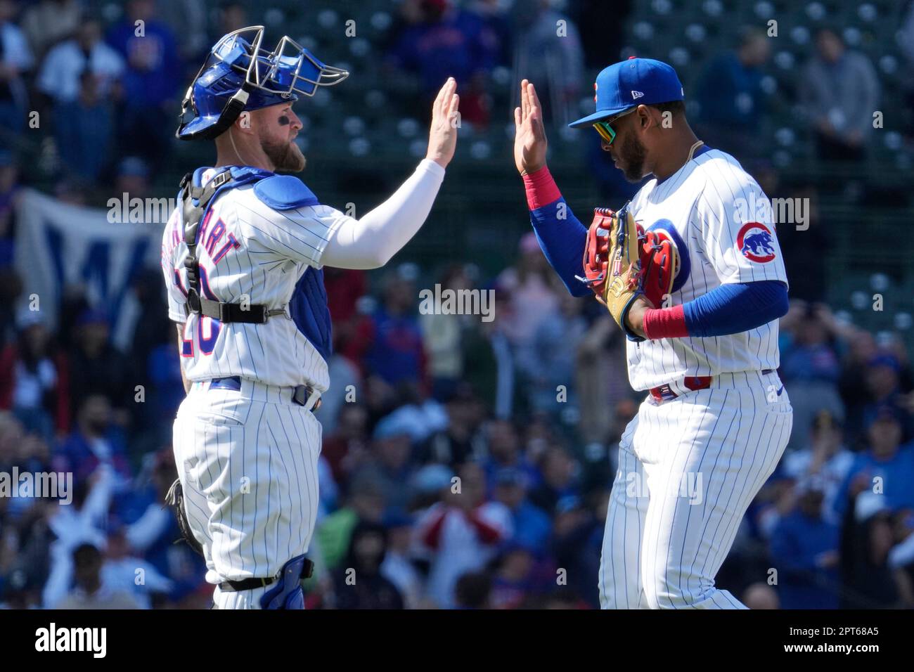 Chicago Cubs catcher Tucker Barnhart, left, celebrates with center fielder  Nelson Velazquez after the Cubs defeated the San Diego Padres 5-2 in a  baseball game in Chicago, Thursday, April 27, 2023. (AP