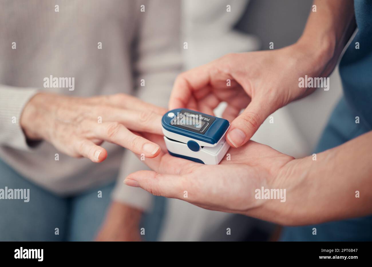 Hands, patient and finger pulse with nurse to monitor oxygen, rate and