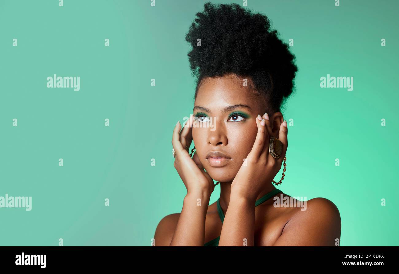 Model, eyes and green makeup with hands on face with vision, thinking