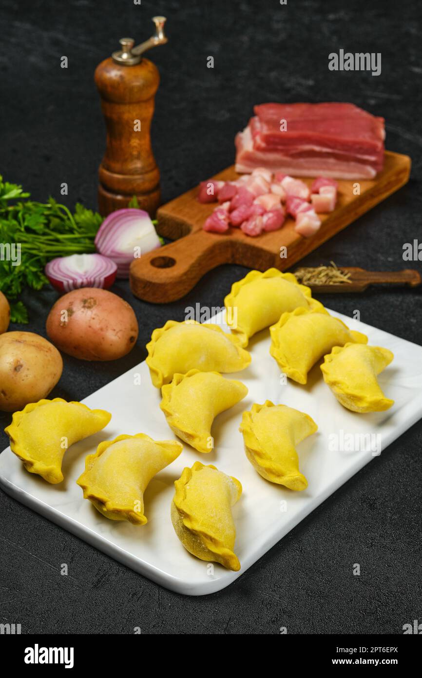 Frozen dumplings with bacon and potato Stock Photo Alamy