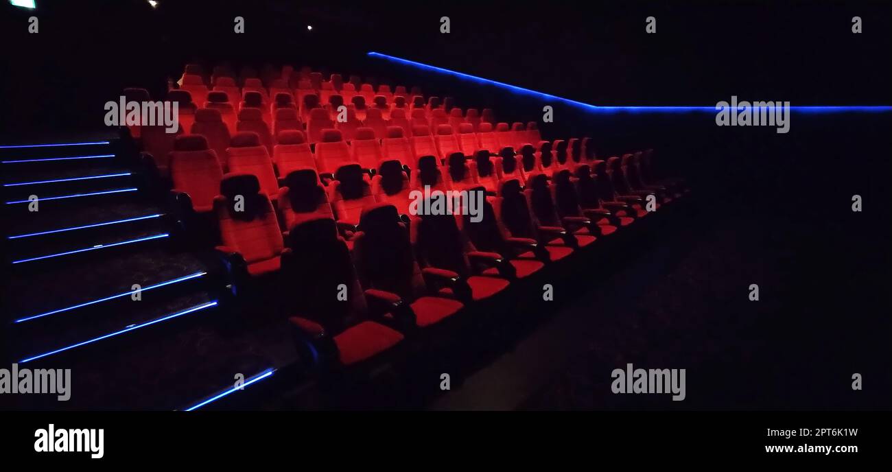 Empty cinema hall with red seats. Interior of modern movie theatre ...
