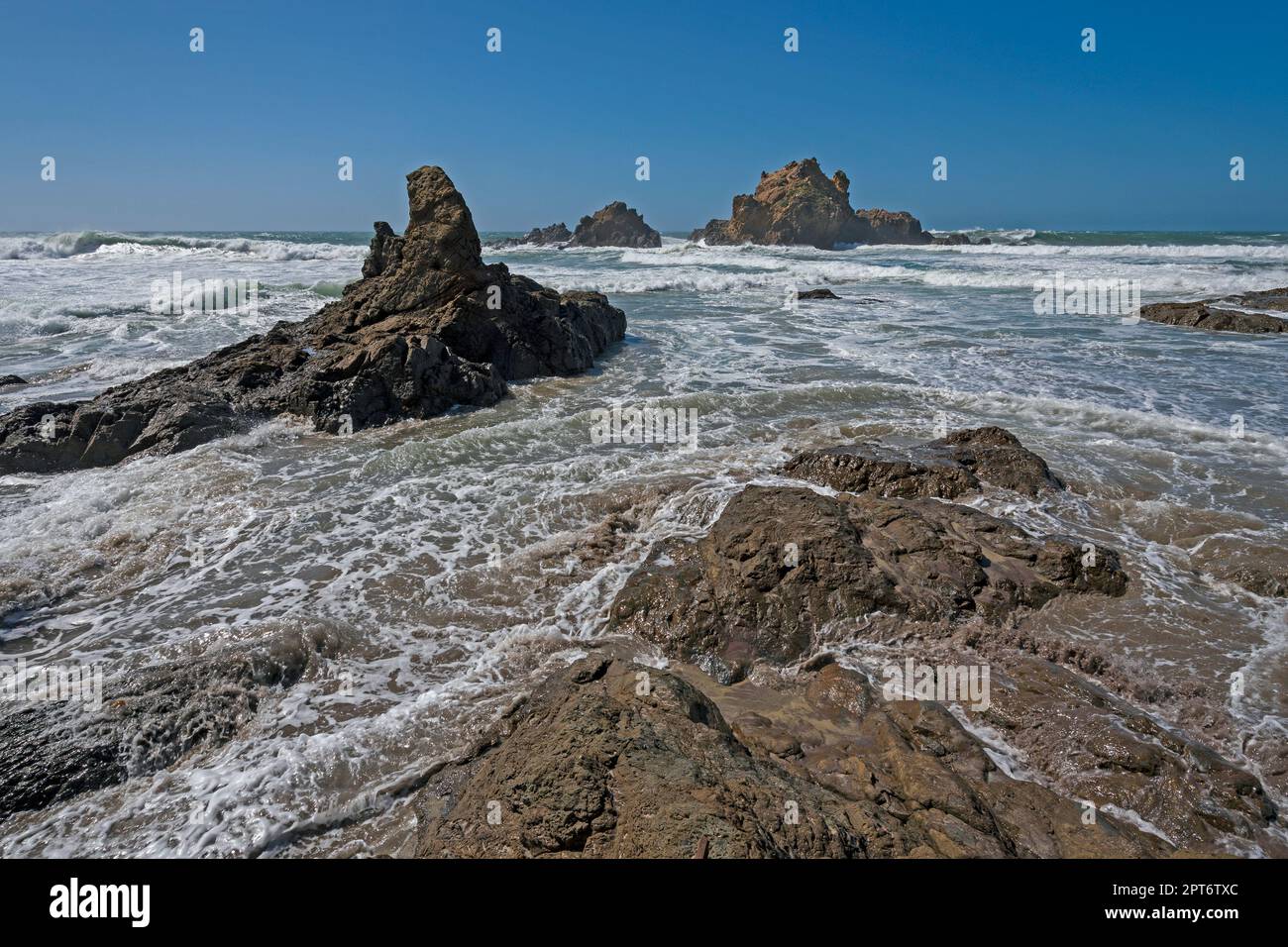 Churning Waters Covering the Coastal Rocks in Pfeiffer Beach State Park in California Stock Photo