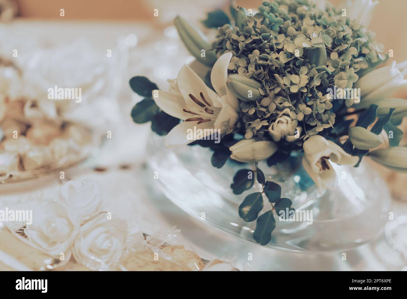 Closeup Still Life of a Gentle White Floral Bouquet. Tender Centerpiece. Wedding Table Decor Stock Photo