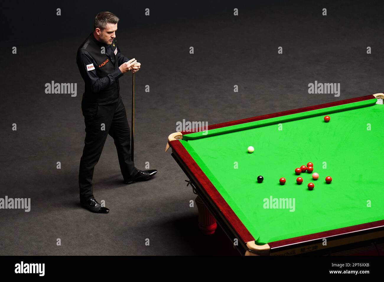 Mark Selby in action against Mark Allen (not pictured) on day thirteen of the Cazoo World Snooker Championship at the Crucible Theatre, Sheffield