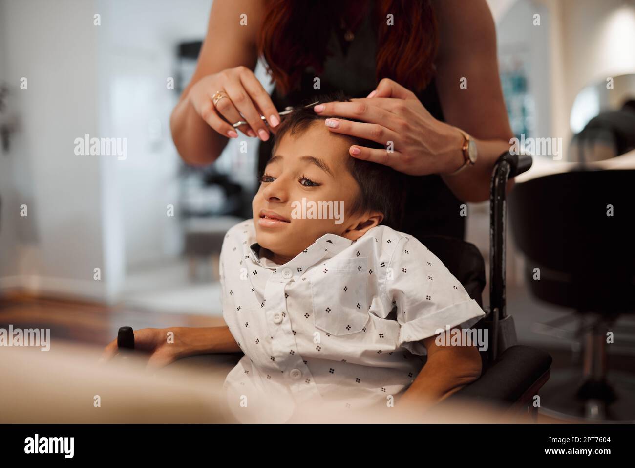 Hairdresser, disability and wheelchair handicap child with cerebral