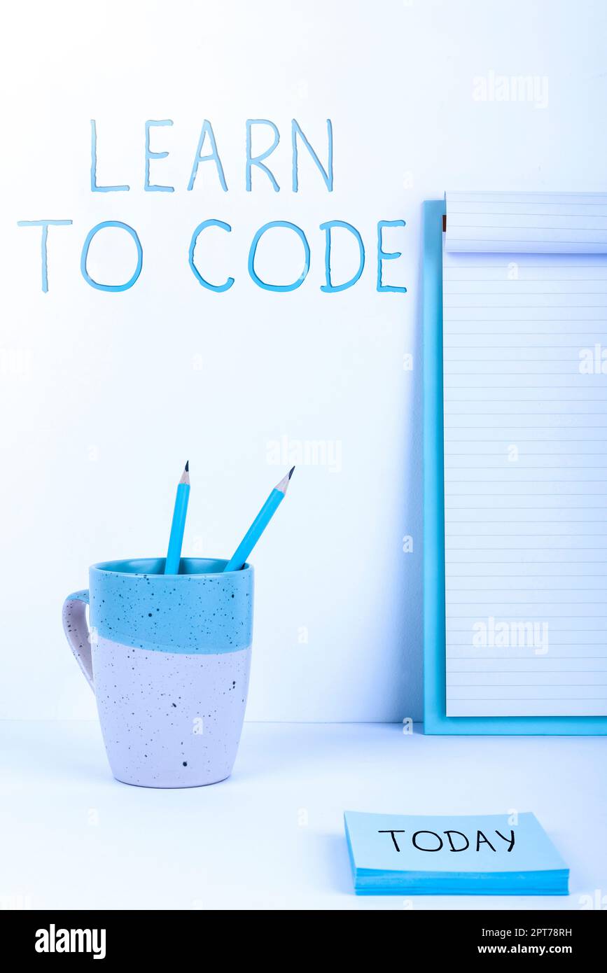 Hand writing sign Learn To Code, Word Written on Learn to write Software Be a Computer Programmer Coder Stock Photo