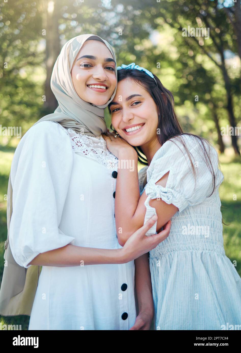 Women happy in garden, forest park with trees and outdoor garden picnic in multicultural summer fashion. Portrait of female friends together, muslim g Stock Photo