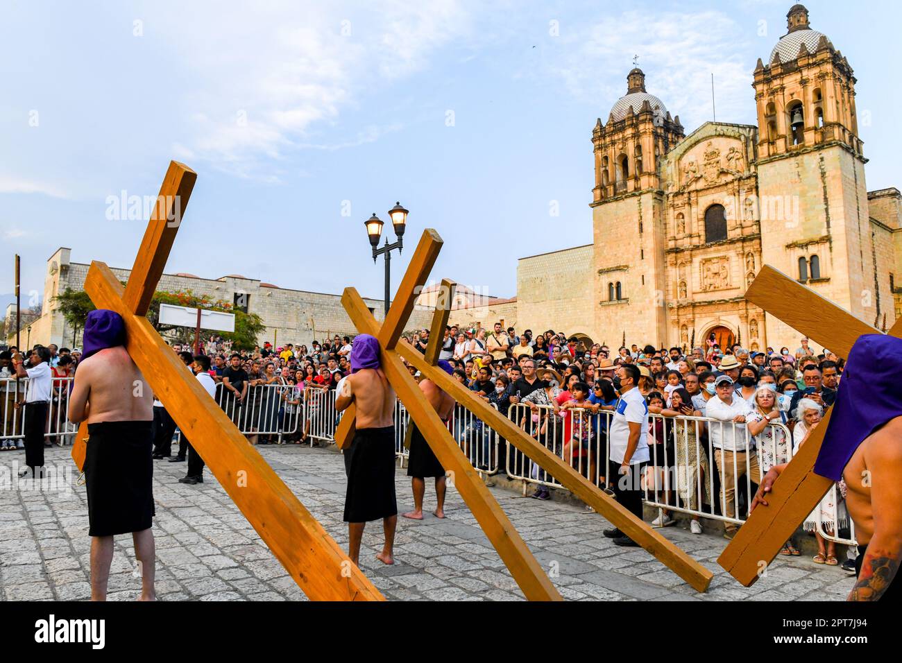 Good Friday Silent procession in Oaxaca Mexico during the Semana Santa  (Easter)/ Participants with crosses wear hoods to create anonymity and symbolize equality before God Stock Photo